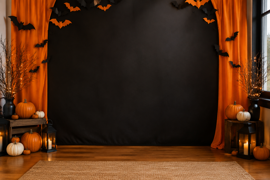 Warmly lit black and orange Halloween photo corner with pumpkins and a clear center for guests