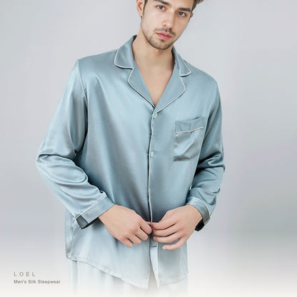 Model wearing the LOEL mens mulberry silk long sleeve pajama set in tile blue