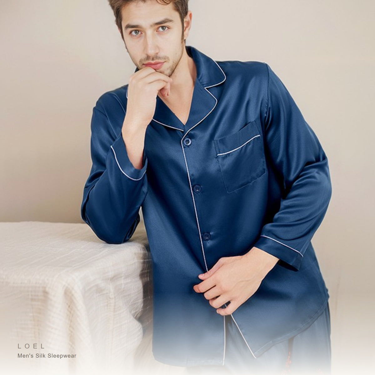 Model wearing the LOEL mens mulberry silk long sleeve pajama set in navy blue