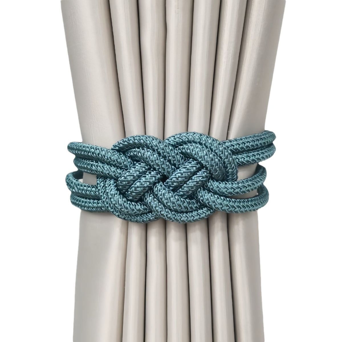 Tieback holding beige curtains