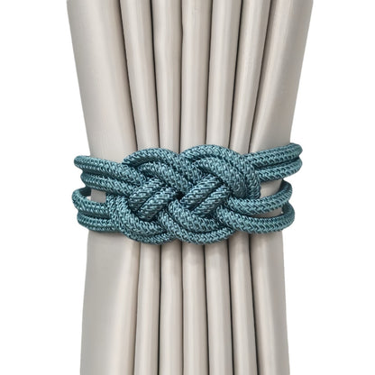 Tieback holding beige curtains