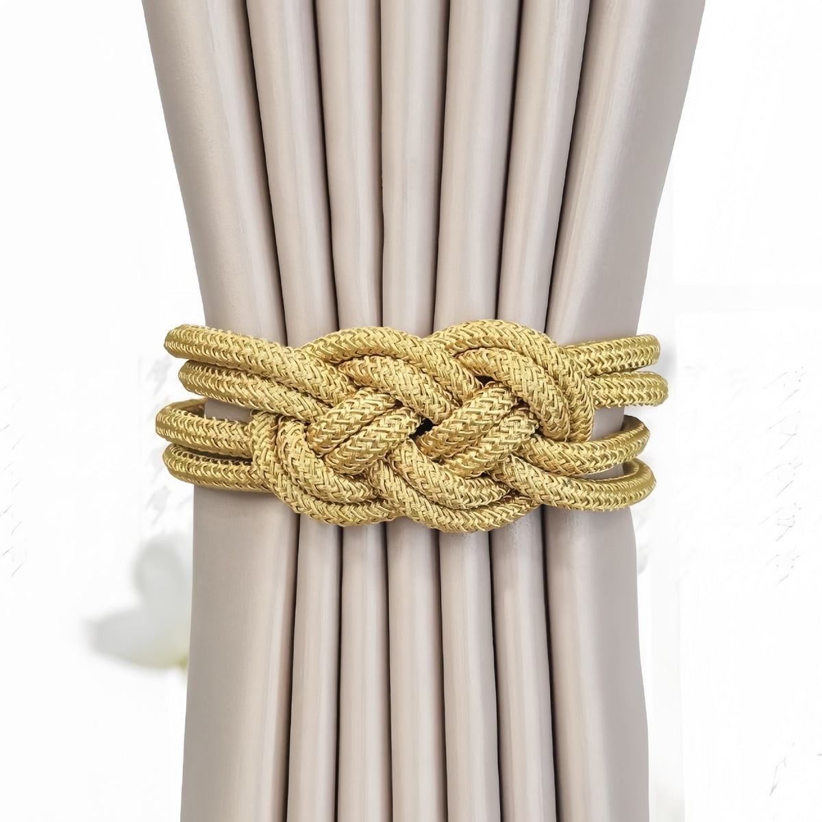 Tieback holding beige curtains