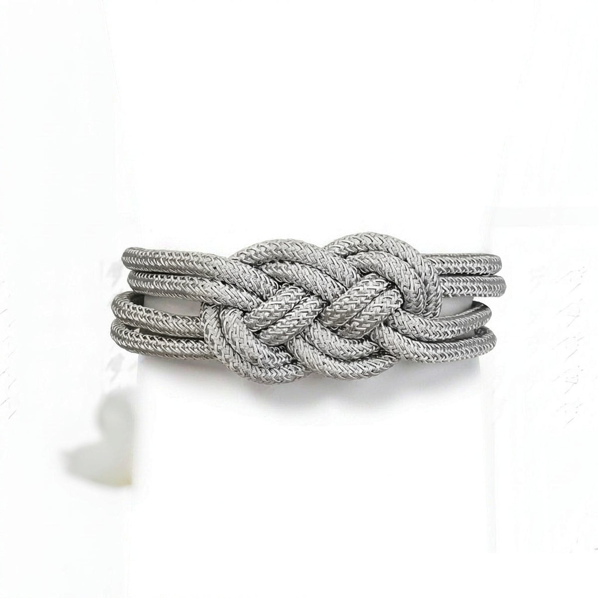 Magnetic curtain tieback on pure white background