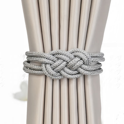 Tieback holding beige curtains