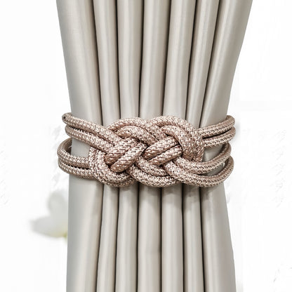 Tieback holding beige curtains