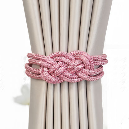 Tieback holding beige curtains